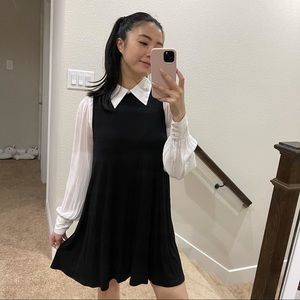 Mock neck sleeveless black dress.